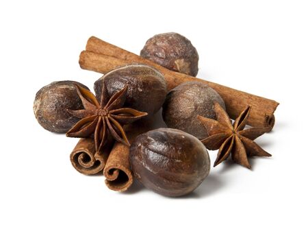 anise, cinnamon, nutmeg on a white backgroundの写真素材