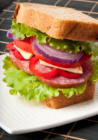Healthy ham sandwich with cheese, tomatoes and lettuceの写真素材