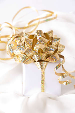 Gold ribbon gift with festive holiday background