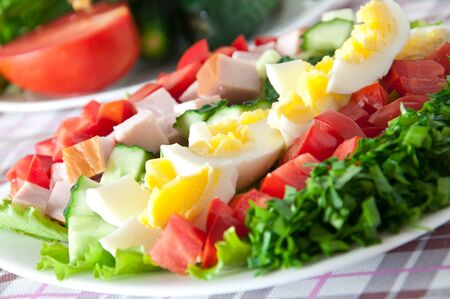 Fresh salad with chicken breast,lettuce, eggs and tomatoesの写真素材