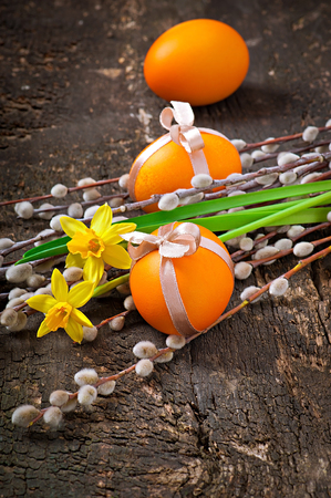 Colorful easter eggs on old wooden の写真素材
