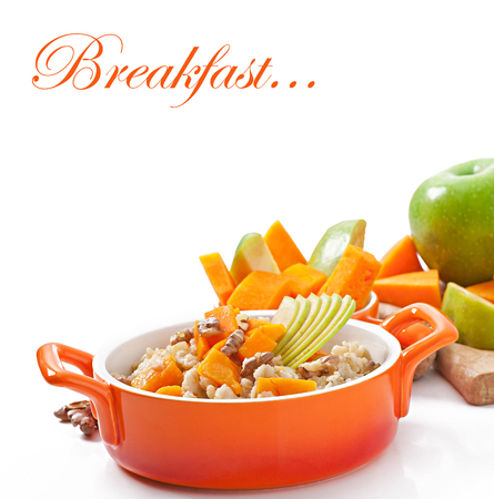 Oatmeal with pumpkin, apples, nuts and honeyの写真素材