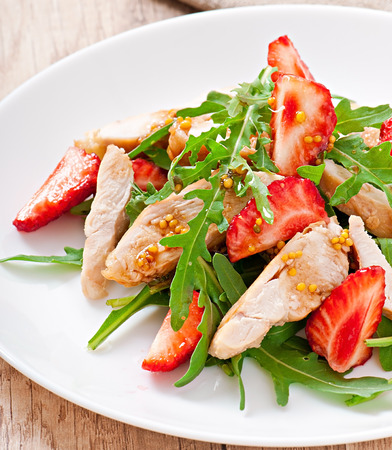 Chicken salad with arugula and strawberriesの写真素材