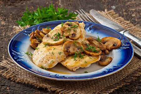 Chicken breast grilled with mushroomsの写真素材