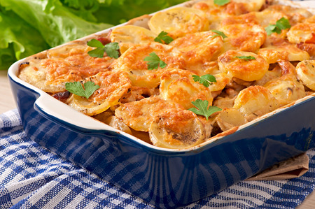 Potato casserole with meat and mushrooms with cheese crustの写真素材