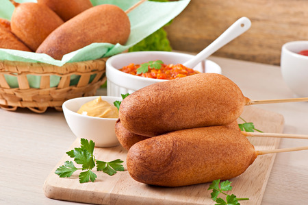 Homemade corn dogs with saucesの写真素材
