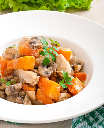 Stew chicken with vegetables and mushrooms in a cream sauceの写真素材