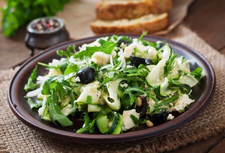 Zucchini salad with feta, olives and pine nutsの写真素材