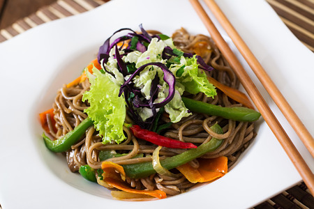 Soba noodles with beef, carrots, onions and sweet peppersの写真素材