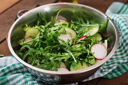 Ingredients for Salad arugula, radish, cucumber and spicesの写真素材