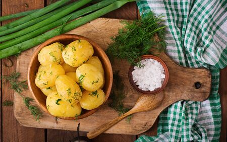 Boiled new potatoes seasoned with dill and butter. Top viewの写真素材