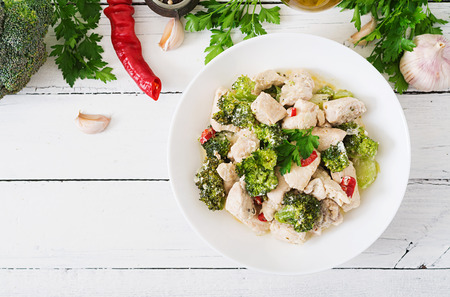 Delicate saute chicken with broccoli and chili peppers in a creamy garlic sauce. Top viewの写真素材