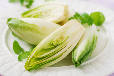 Fresh and healthy Chicory (witloof) Salad on a plate. Dietary menu. Healthy food.の写真素材