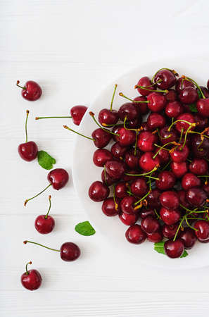 Ripe Sweet Cherry on a plate. Flat lay. Top view