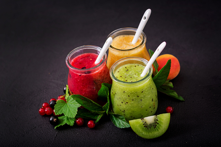 Fresh healthy smoothies from different berries on a dark background. Diet menu. Proper nutrition.の写真素材