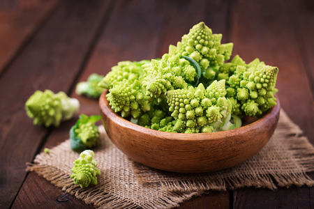 Cabbage romanesco on a dark wooden backgroundの写真素材