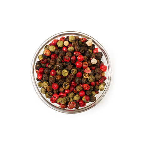 Mix of pepper in a bowl isolated on a white background