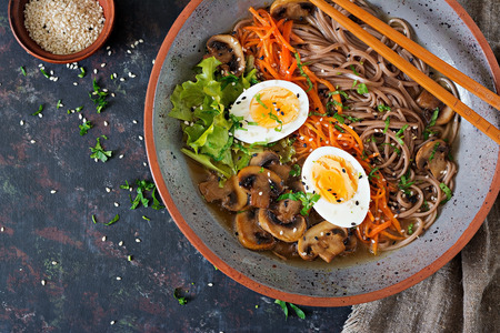 Japanese miso ramen noodles with eggs, carrot and mushrooms. Soup delicious food. Flat lay. Top viewの写真素材