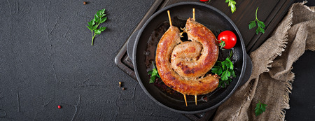 Homemade sausage barbecue. Picnic menu. Festive food.Top view. Flat lay. Banner.の写真素材