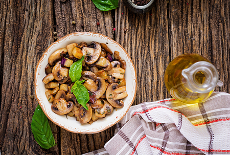 Saute with mushrooms, eggplant, aubergines and basil. Vegetable stew. Vegetarian, vegan food. Healthy meal. Top view. Flat layの写真素材