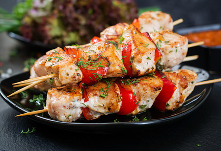 Chicken skewers with slices of sweet peppers and dill. Tasty food. Weekend meal.の写真素材