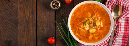 Traditional Russian soup with cabbage - sauerkraut soup - shchi. Banner. Top viewの写真素材