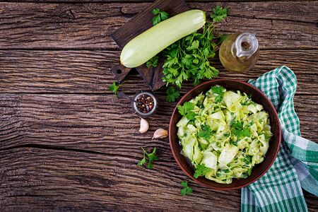 Salad of marinated zucchini in spices. Vegan food. Healthy meal. Top viewの写真素材