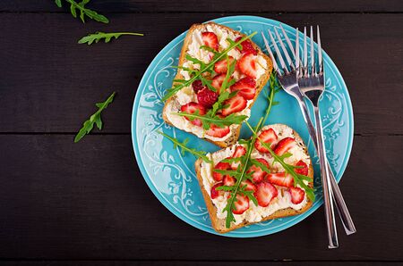 Healthy sandwich with strawberry and cream cheese. Top viewの写真素材