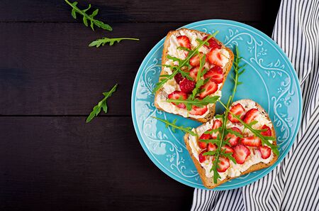 Healthy sandwich with strawberry and cream cheese. Top viewの写真素材