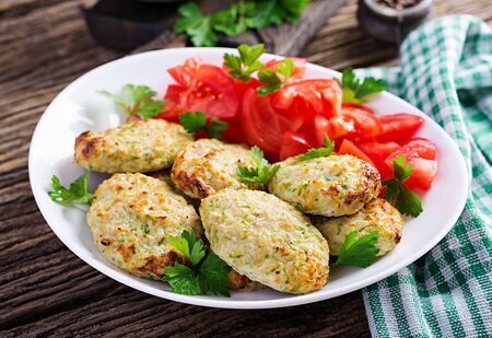 Chicken cutlet with zucchini and tomatoes salad. Healthy food.の写真素材