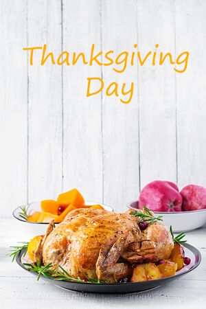 Roasted turkey garnished with cranberries on a rustic style table decorated  autumn leaf. Thanksgiving Day. Baked chicken.の写真素材