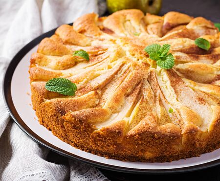 Homemade pie with pears and almond flour  on dark background.の写真素材