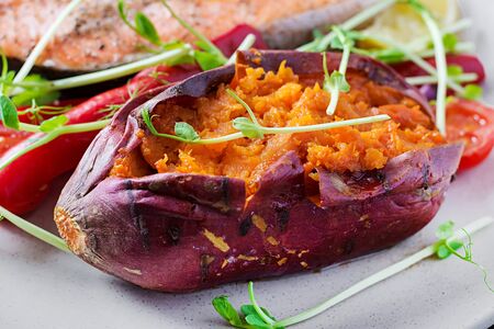 Baked sweet potatoes with butter. Vegetarian cuisine. Diet menu.の写真素材