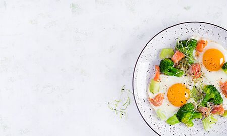 Ketogenic/paleo diet. Fried eggs, salmon, broccoli and microgreen.  Keto breakfast. Brunch.  Top view, overheadの写真素材