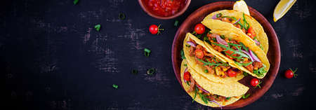 Taco. Mexican tacos with beef meat, corn and salsa. Mexican cuisine. Top view, flat lay, bannerの写真素材