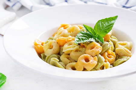 Italian ravioli pasta with spinach and ricotta in white plate. Italian tortellini pasta.の写真素材