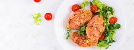 Meatballs with cabbage. Lazy cabbage rolls with fresh salad on light background. Russian cuisine. Top view, banner, copy spaceの写真素材