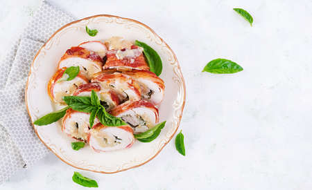 Baked chicken rolls with basil and cheese on  plate. Healthy lunch. Keto diet.Top view, aboveの写真素材