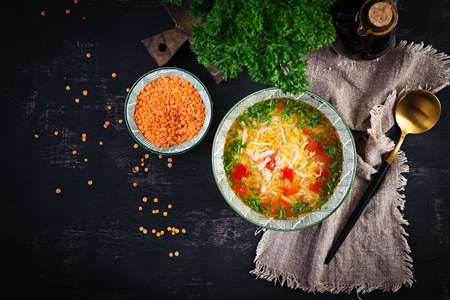 Chicken soup with red lentils and paprika. Traditional Mediterranean food. Healthy food. Top view, aboveの写真素材