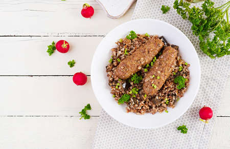 healthy dinner. Lunch bowl with buckwheat porridge, baked meat cutlets and roasted eggplants. Top view, aboveの写真素材