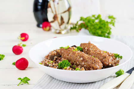 healthy dinner. Lunch bowl with buckwheat porridge, baked meat cutlets and roasted eggplants.の写真素材