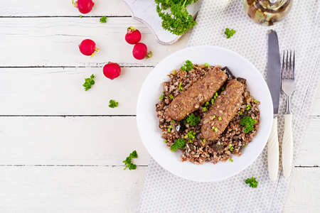 healthy dinner. Lunch bowl with buckwheat porridge, baked meat cutlets and roasted eggplants. Top view, aboveの写真素材