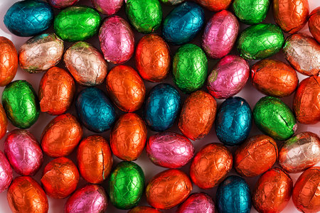 Colorful Easter eggs background. Chocolate Easter eggs texture. top view