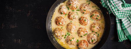 Swedish meatballs in cream sauce. Swedish food. Turkish meatballs. top view bannerの写真素材