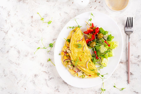 Healthy breakfast.Quesadilla with omelette, chicken fillet, corn and fresh salad. Keto, ketogenic...