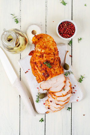 Chicken pastrami with red paprika and red pepper. Meat delicacy. Diet food. Top view, flat layの写真素材