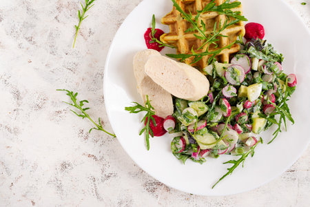 Breakfast homemade chicken sausage with waffle and fresh salad. Keto, ketogenic breakfast. Trendy breakfast. Top viewの写真素材