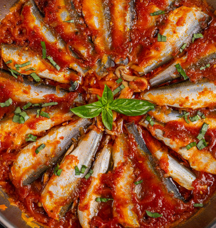 Sardines stewed in tomato sauce with spices. Lunch or dinner. Diet menu. Keto diet. Top view. Texture, backgroundの写真素材