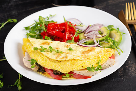 Healthy breakfast. Quesadilla with omelet, cheese, tomatoes and vegetables.の写真素材