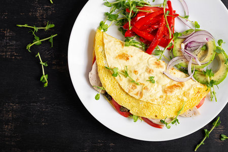 Healthy breakfast. Quesadilla with omelet, cheese, tomatoes and vegetables. Top viewの写真素材